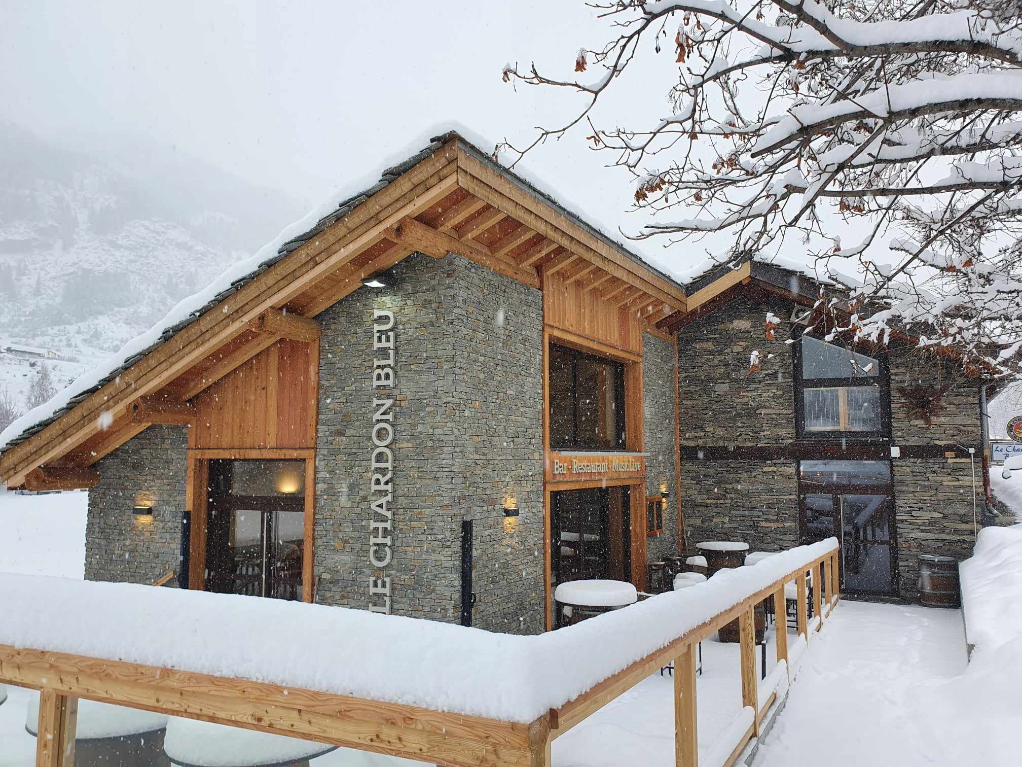 Snow-covered terrace of the Pub Le Chardon Bleu in Val Cenis