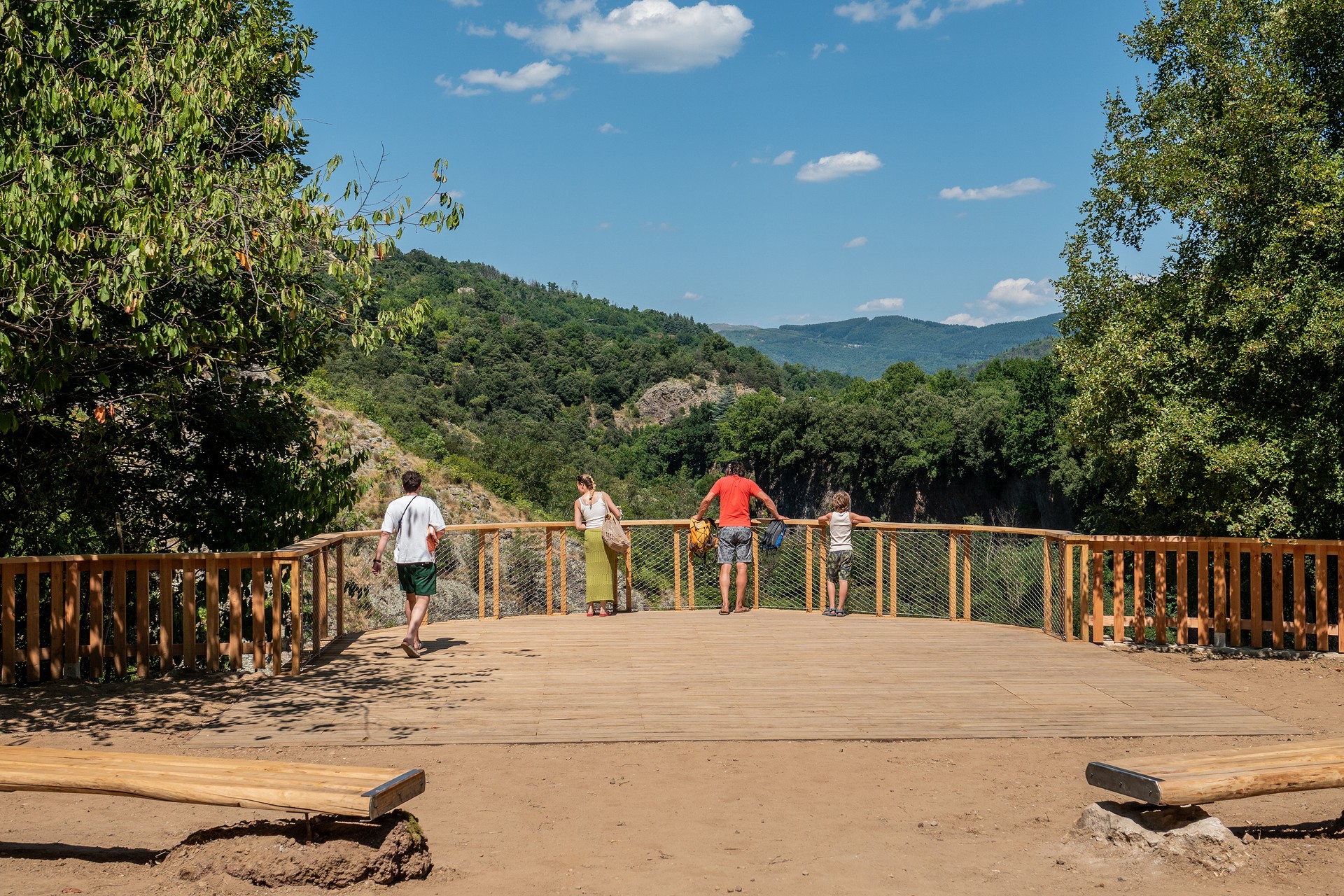 Family observing the landscape from the turbine viewpoint in Jaujac