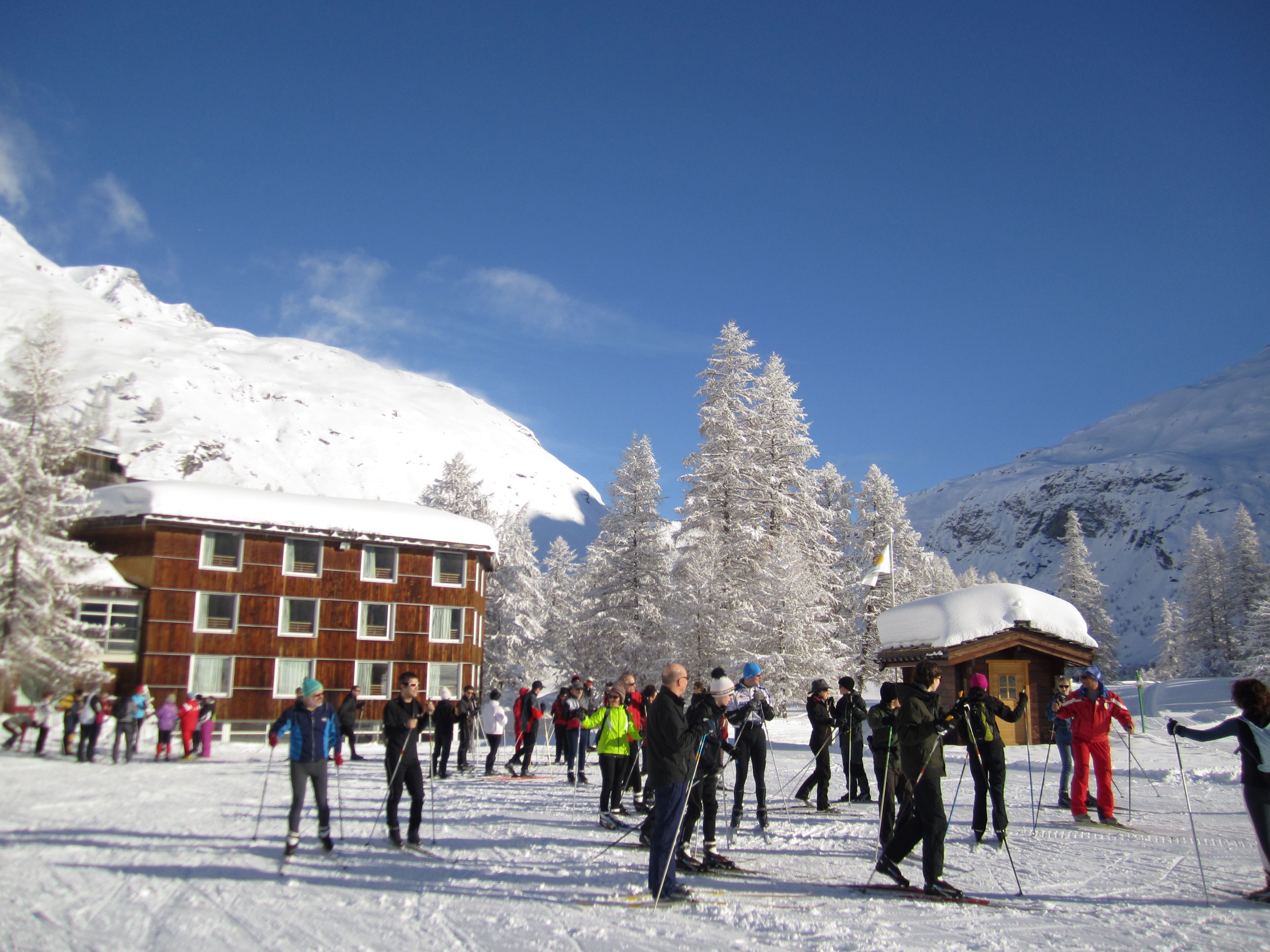 Skiers in front of the center in winter