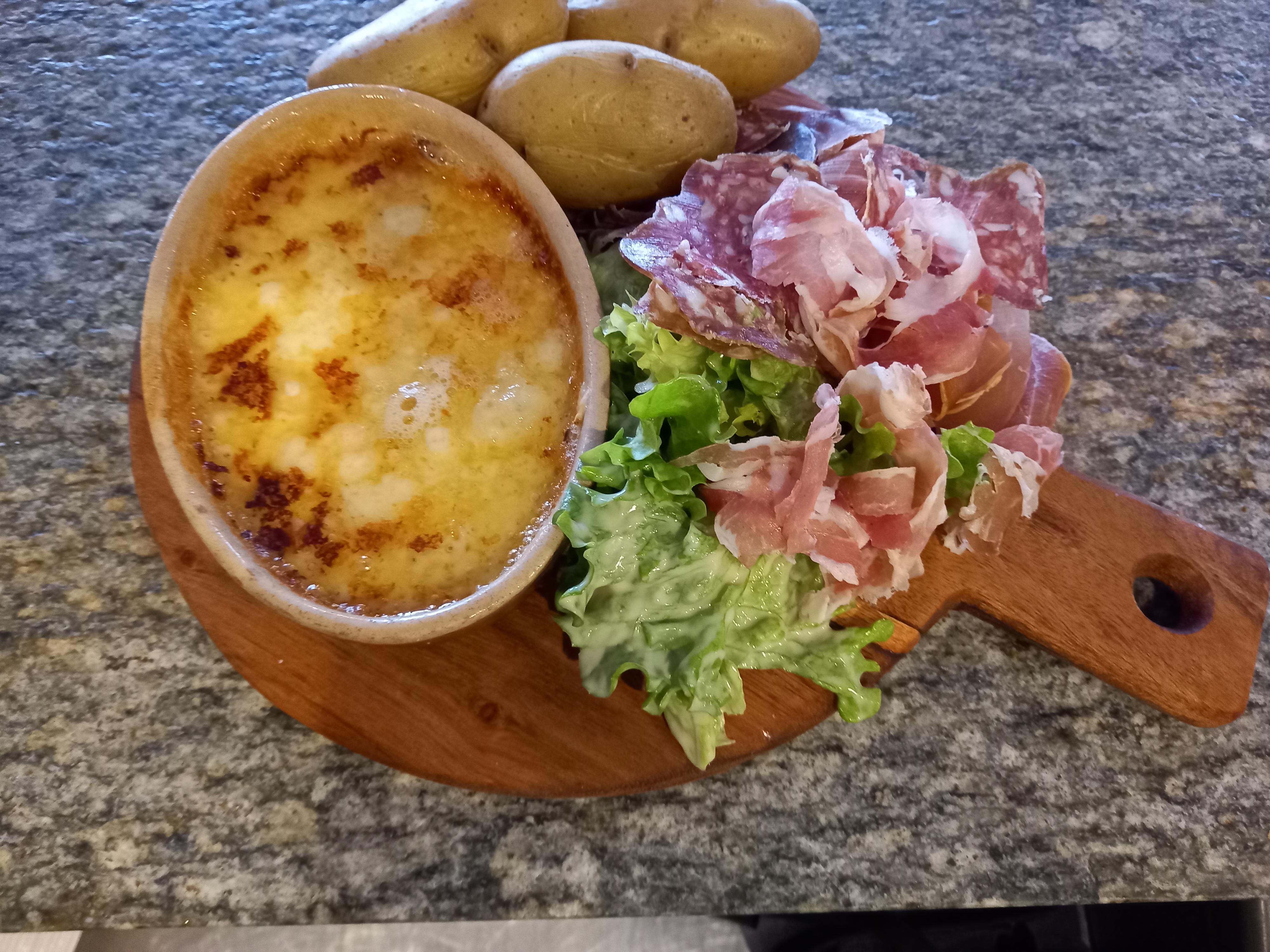 Individual raclette with cold cuts and salad