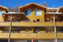 Front view of the upper floors of the residence, with terraces and windows