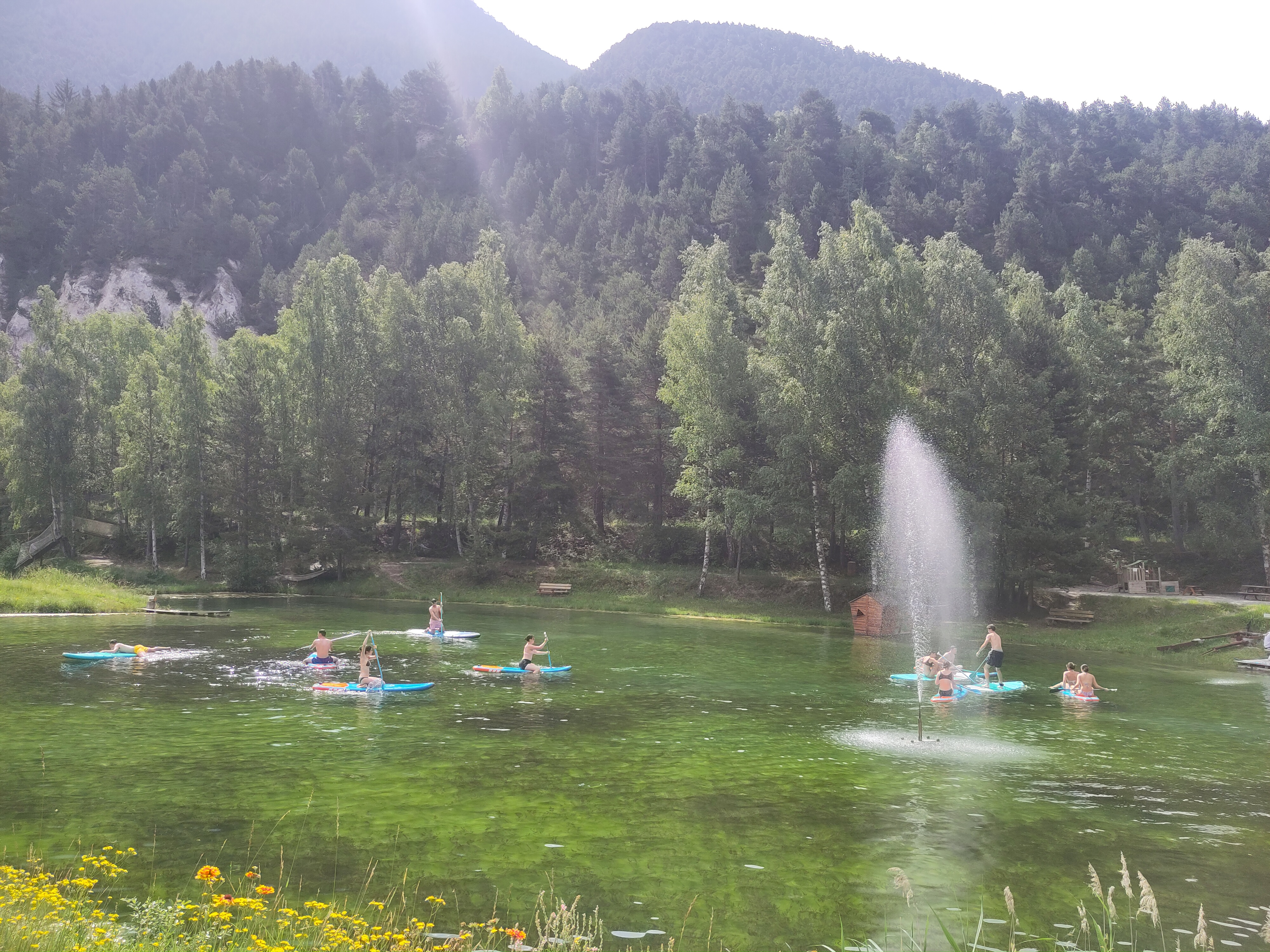 Several paddles on the lake with the water jet