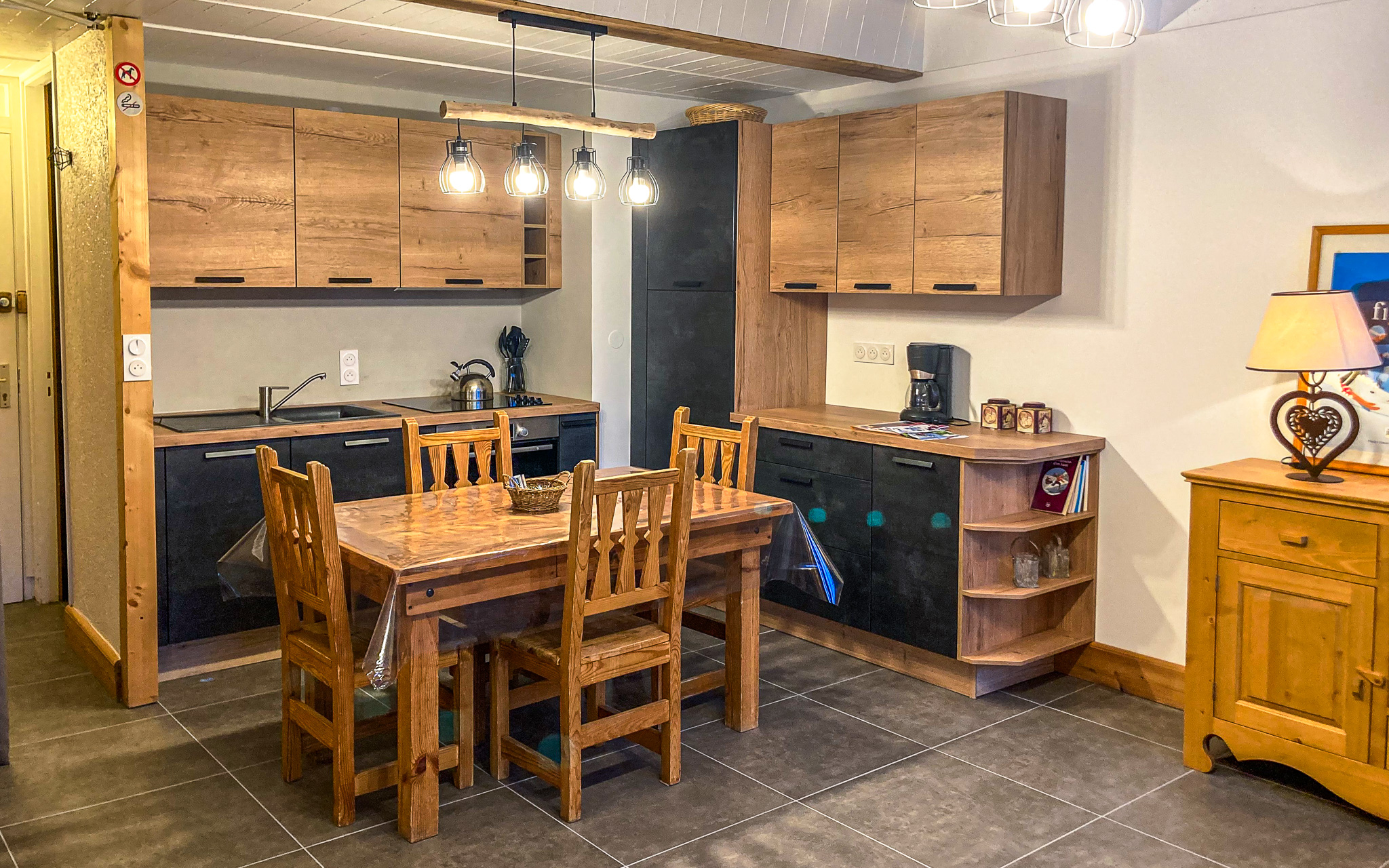 Living room with dining table and kitchen area