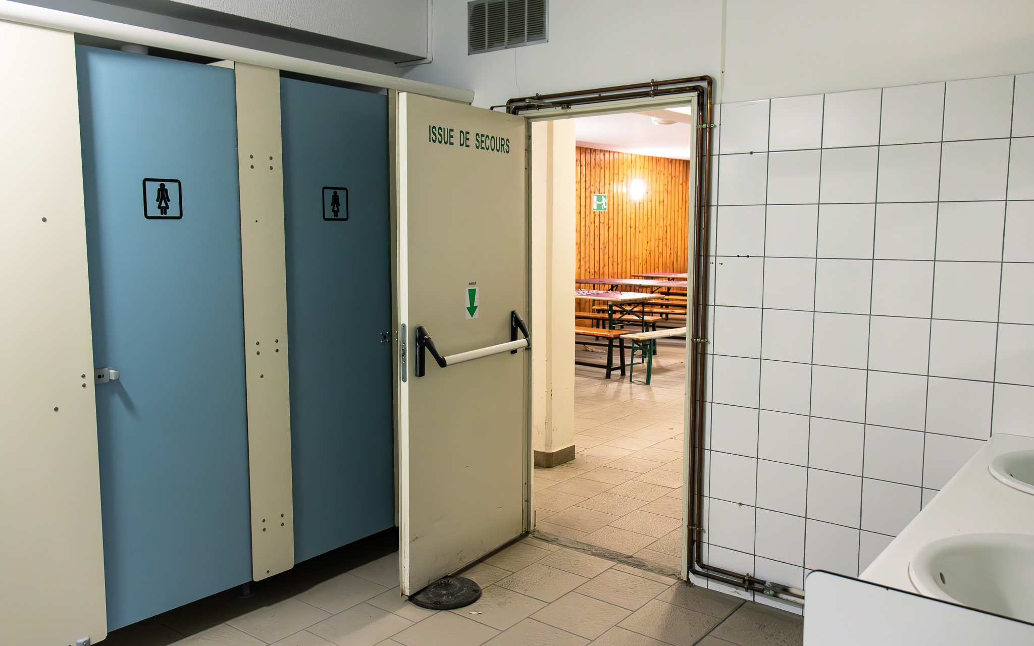 Inside the public toilets with the out-of-bagroom in the background